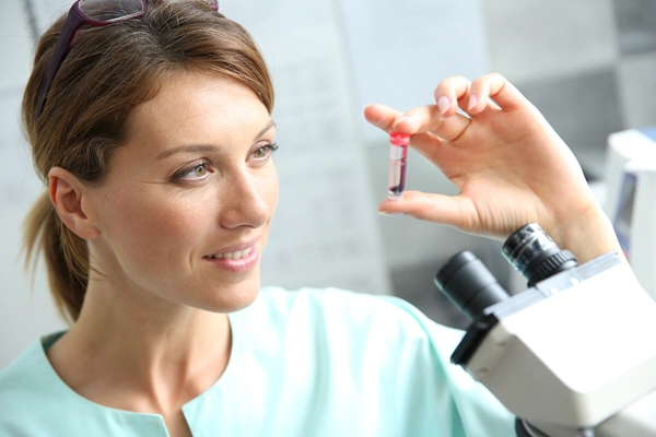 biologist checking on blood sample