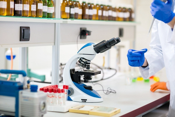 doctor examines blood sample with microscope