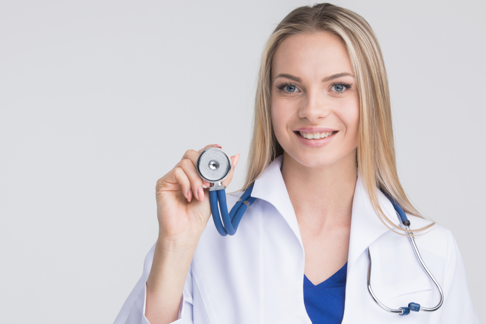 doctor female holding blue stethoscope