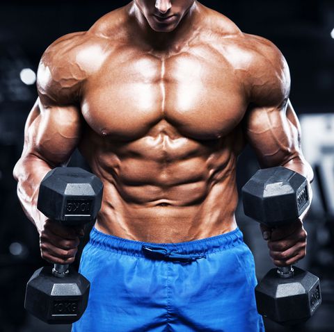 mh muscular man working out in gym with dumbbells