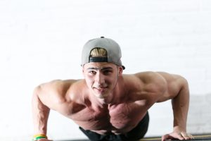 strong man doing pushups 300x200