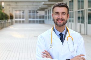 Doctor wearing white coat 300x200