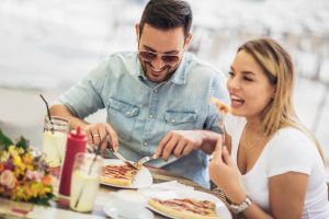 Happy couple sharing food 300x200