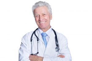 senior male doctor with arms crossed 300x200