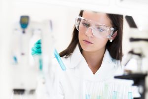 chemical laboratory scene attractive young testosterone phd student scientist observing the blue indicator  300x200