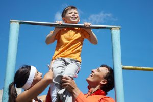 graphicstock image of happy parents helping their son to do physical exercise_HpFkj5JeNW 300x200