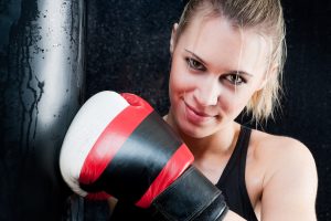 blond boxing training woman with gloves in gym SBI 300902506 300x200