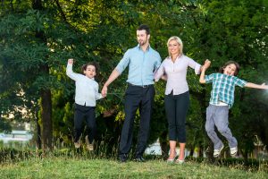 happy family having fun outdoors in the park_BYL0nLTBs 300x200