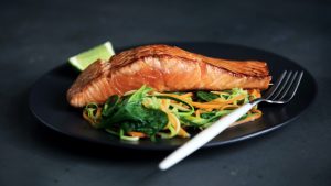Salmon with vegetables on the side, on a plate