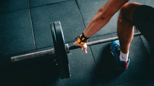 A man preparing to deadlift a weighted barbell because exercise a great way of boosting your testosterone levels