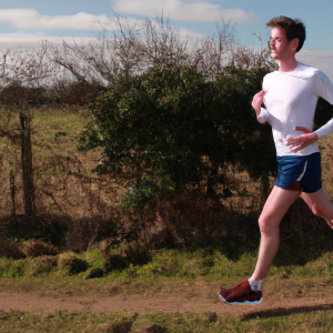 a professional appealing image of a caucasian man or woman jogging on a sunny day 303 300x300