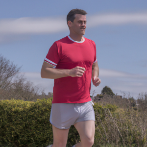 a professional appealing image of a caucasian man or woman jogging on a sunny day 713 300x300