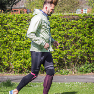 a professional appealing good looking and atheletic image of a caucasian man exercising or playing sports outside on a sunny day